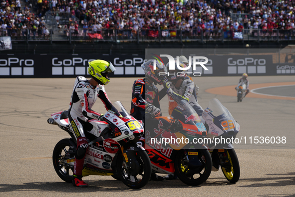 Luca Lunetta (58) of Italy and Sic58 Squadra Corse Honda, Jose Antonio Rueda (99) of Spain and Red Bull KTM Ajo KTM and Collin Veijer (95) o...