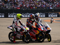 Luca Lunetta (58) of Italy and Sic58 Squadra Corse Honda, Jose Antonio Rueda (99) of Spain and Red Bull KTM Ajo KTM and Collin Veijer (95) o...