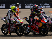 Luca Lunetta (58) of Italy and Sic58 Squadra Corse Honda, Jose Antonio Rueda (99) of Spain and Red Bull KTM Ajo KTM and Collin Veijer (95) o...