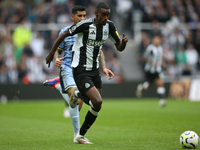 Newcastle United's Alexander Isak runs with the ball during the Premier League match between Newcastle United and Tottenham Hotspur at St. J...