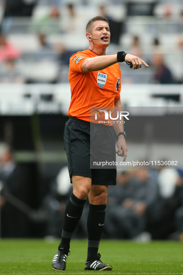 Referee Robert Jones officiates the Premier League match between Newcastle United and Tottenham Hotspur at St. James's Park in Newcastle, En...