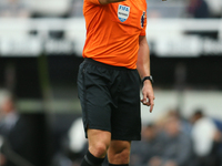 Referee Robert Jones officiates the Premier League match between Newcastle United and Tottenham Hotspur at St. James's Park in Newcastle, En...