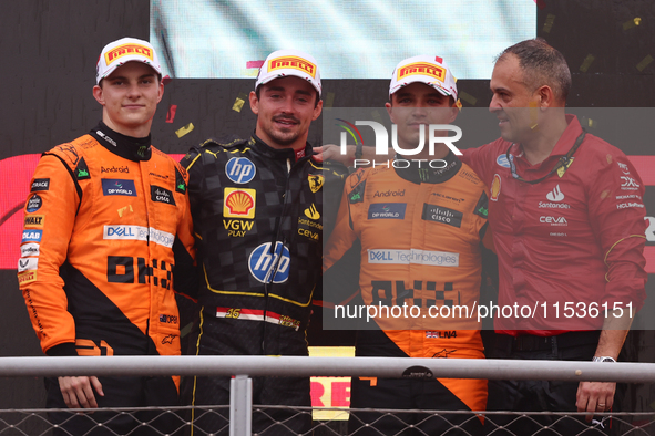 Lando Norris of McLaren, Charles Leclerc of Ferrari and Lando Norris of McLaren after the Formula 1 Italian Grand Prix at Autodromo Nazional...