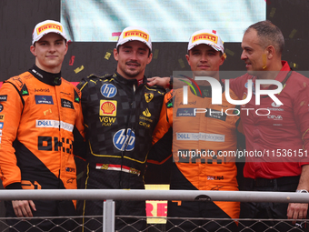 Lando Norris of McLaren, Charles Leclerc of Ferrari and Lando Norris of McLaren after the Formula 1 Italian Grand Prix at Autodromo Nazional...