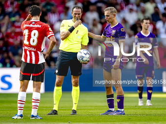 Referee Bas Nijhuis and Go Ahead Eagles player Finn Stokkers during the match between PSV and Go Ahead Eagles at the Philips Stadium for the...