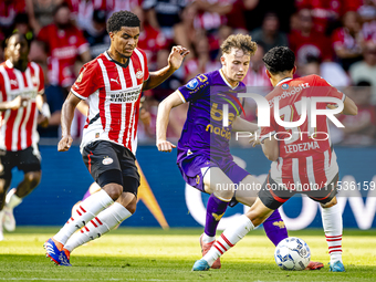 Go Ahead Eagles player Jakob Breum and PSV player Richard Ledezma during the match PSV vs. Go Ahead Eagles at the Philips Stadium for the Du...