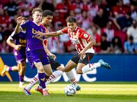 Go Ahead Eagles player Jakob Breum and PSV player Richard Ledezma during the match PSV vs. Go Ahead Eagles at the Philips Stadium for the Du...