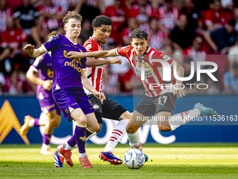 Go Ahead Eagles player Jakob Breum and PSV player Richard Ledezma during the match PSV vs. Go Ahead Eagles at the Philips Stadium for the Du...