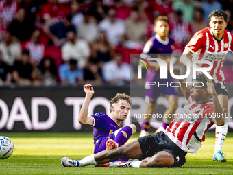 Go Ahead Eagles player Jakob Breum and PSV player Ryan Flamingo during the match PSV vs. Go Ahead Eagles at the Philips Stadium for the Dutc...