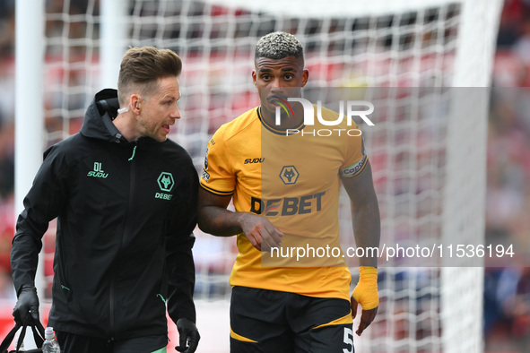 Mario Lemina of Wolverhampton Wanderers leaves the pitch after suffering an injury during the Premier League match between Nottingham Forest...