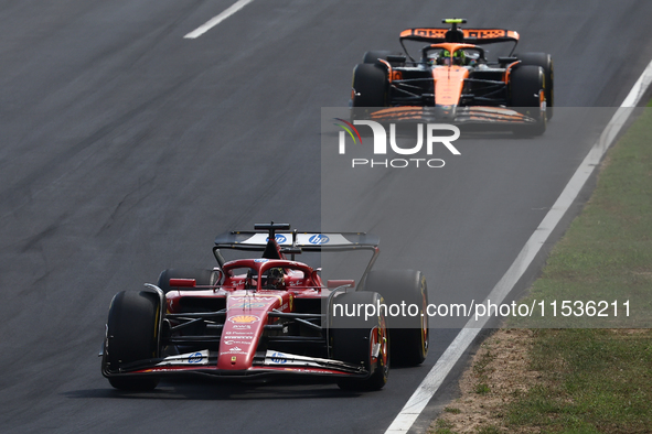 Charles Leclerc of Ferrari and Lando Norris of McLaren during the Formula 1 Italian Grand Prix at Autodromo Nazionale di Monza in Monza, Ita...