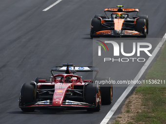 Charles Leclerc of Ferrari and Lando Norris of McLaren during the Formula 1 Italian Grand Prix at Autodromo Nazionale di Monza in Monza, Ita...