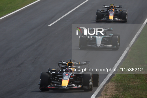 Max Verstappen of Red Bull Racing, George Russell of Mercedes and Sergio Perez of Red Bull Racing during the Formula 1 Italian Grand Prix at...