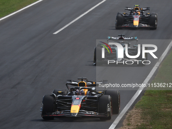 Max Verstappen of Red Bull Racing, George Russell of Mercedes and Sergio Perez of Red Bull Racing during the Formula 1 Italian Grand Prix at...