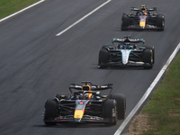 Max Verstappen of Red Bull Racing, George Russell of Mercedes and Sergio Perez of Red Bull Racing during the Formula 1 Italian Grand Prix at...