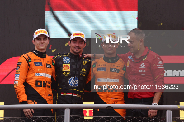 Oscar Piastri of McLaren, Charles Leclerc of Ferrari and Lando Norris of McLaren after the Formula 1 Italian Grand Prix at Autodromo Naziona...