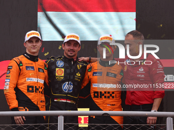 Oscar Piastri of McLaren, Charles Leclerc of Ferrari and Lando Norris of McLaren after the Formula 1 Italian Grand Prix at Autodromo Naziona...