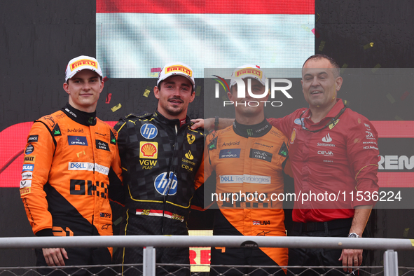 Oscar Piastri of McLaren, Charles Leclerc of Ferrari and Lando Norris of McLaren after the Formula 1 Italian Grand Prix at Autodromo Naziona...