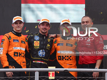 Oscar Piastri of McLaren, Charles Leclerc of Ferrari and Lando Norris of McLaren after the Formula 1 Italian Grand Prix at Autodromo Naziona...