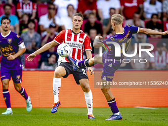 PSV player Joey Veerman and Go Ahead Eagles player Finn Stokkers during the match PSV vs. Go Ahead Eagles at the Philips Stadium for the Dut...