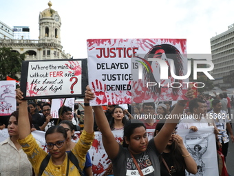 Citizens take part in a protest rally against the rape and murder of a PGT woman doctor at Government-run R G Kar Medical College & Hospital...