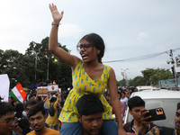 Citizens take part in a protest rally against the rape and murder of a PGT woman doctor at Government-run R G Kar Medical College & Hospital...