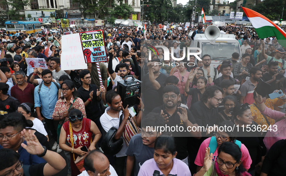 Citizens take part in a protest rally against the rape and murder of a PGT woman doctor at Government-run R G Kar Medical College & Hospital...