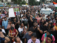 Citizens take part in a protest rally against the rape and murder of a PGT woman doctor at Government-run R G Kar Medical College & Hospital...