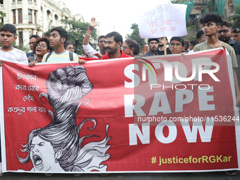 Citizens take part in a protest rally against the rape and murder of a PGT woman doctor at Government-run R G Kar Medical College & Hospital...