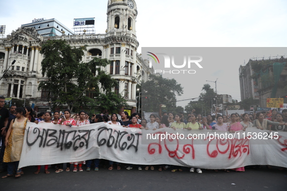 Citizens take part in a protest rally against the rape and murder of a PGT woman doctor at Government-run R G Kar Medical College & Hospital...