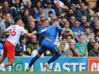 Mackenzie Hunt of Fleetwood Town pulls Wimbledon's Joe Pigott's shirt during the Sky Bet League 2 match between AFC Wimbledon and Fleetwood...