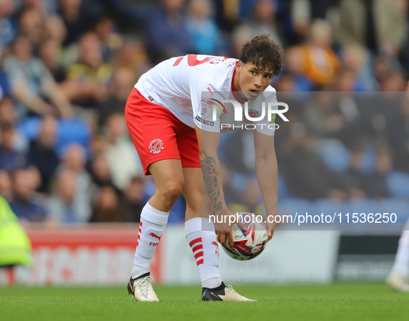 Kayden Hughes of Fleetwood Town prepares the ball for the goalkeeper during the Sky Bet League 2 match between AFC Wimbledon and Fleetwood T...