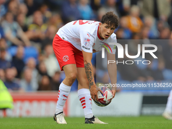 Kayden Hughes of Fleetwood Town prepares the ball for the goalkeeper during the Sky Bet League 2 match between AFC Wimbledon and Fleetwood T...