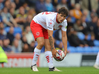 Kayden Hughes of Fleetwood Town prepares the ball for the goalkeeper during the Sky Bet League 2 match between AFC Wimbledon and Fleetwood T...