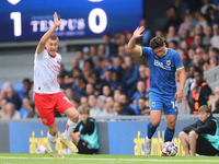 Rhys Bennett and Mat Stevens both claim the ball during the Sky Bet League 2 match between AFC Wimbledon and Fleetwood Town at Plough Lane i...