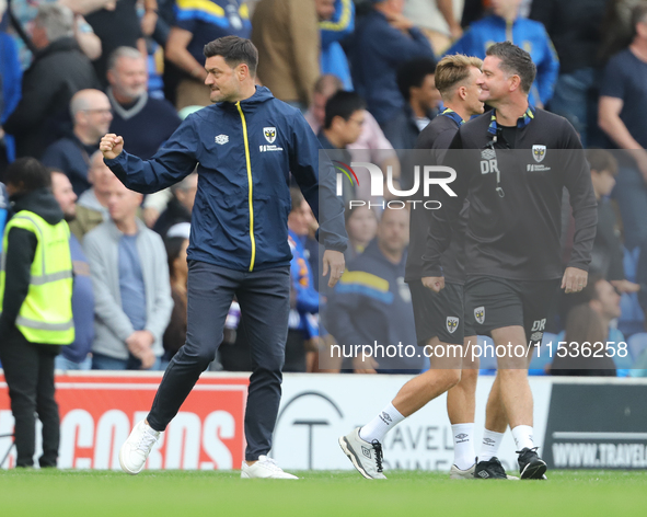 AFC Wimbledon manager Johnnie Jackson celebrates the win after the Sky Bet League 2 match between AFC Wimbledon and Fleetwood Town at Plough...