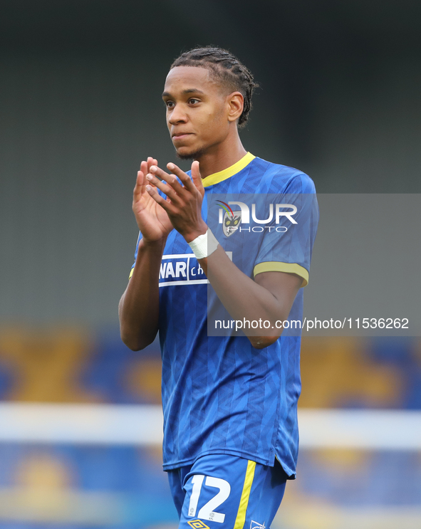 AFC Wimbledon player Alistair Smith claps for the fans after the Sky Bet League 2 match between AFC Wimbledon and Fleetwood Town at Plough L...