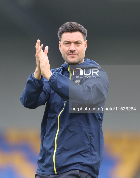 AFC Wimbledon manager Johnnie Jackson claps for the fans after the Sky Bet League 2 match between AFC Wimbledon and Fleetwood Town at Plough...