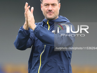 AFC Wimbledon manager Johnnie Jackson claps for the fans after the Sky Bet League 2 match between AFC Wimbledon and Fleetwood Town at Plough...