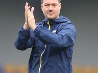 AFC Wimbledon manager Johnnie Jackson claps for the fans after the Sky Bet League 2 match between AFC Wimbledon and Fleetwood Town at Plough...