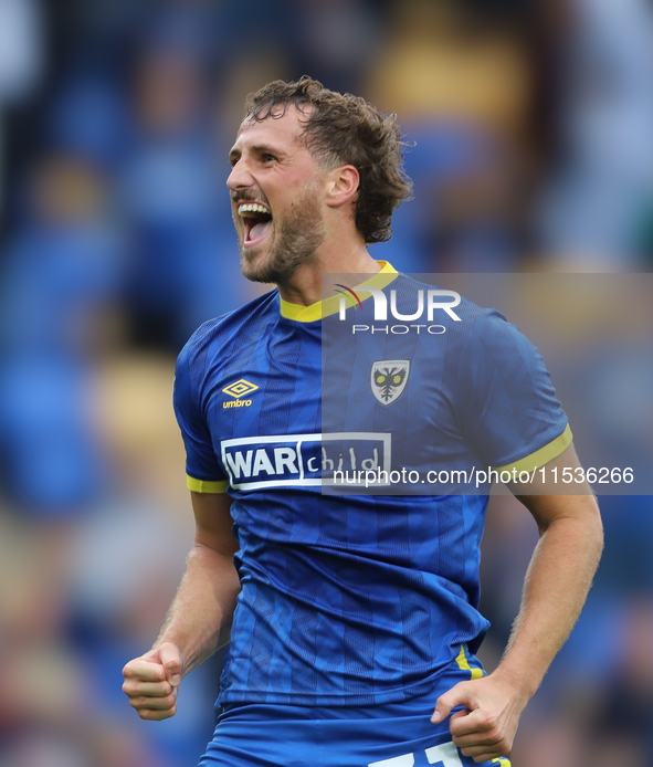 AFC Wimbledon player Joe Lewis celebrates with the fans after the Sky Bet League 2 match between AFC Wimbledon and Fleetwood Town at Plough...