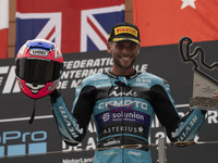 Jake Dixon stands on the winner's podium for the Moto2 category, representing the CFMOTO Inde Aspar Team on a KALEX bike, during the Moto Gr...