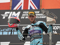 Jake Dixon stands on the winner's podium for the Moto2 category, representing the CFMOTO Inde Aspar Team on a KALEX bike, during the Moto Gr...