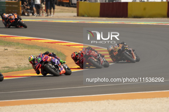 Franco Morbidelli (Ita-Pramac Racing Ducati), Francesco Bagnaia (Ita-Ducati Lenovo Team), and Brad Binder (Saf-Red Bull KTM Factory Racing)...