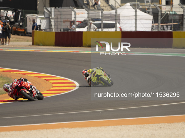 Enea Bastianini (Ita-Ducati Lenovo Team) and Fabio Di Giannantonio (Ita-VR46 Team Ducati) participate in the Moto Grand Prix GoPro of Aragon...