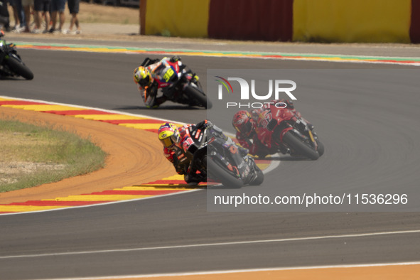 Aleix Espargaro (41) of Aprilia Racing and Augusto Fernandez (37) of GASGAS Factory Racing during the Moto Grand Prix GoPro of Aragon Grand...