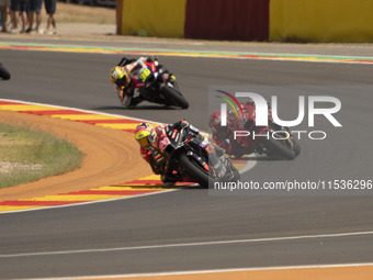 Aleix Espargaro (41) of Aprilia Racing and Augusto Fernandez (37) of GASGAS Factory Racing during the Moto Grand Prix GoPro of Aragon Grand...