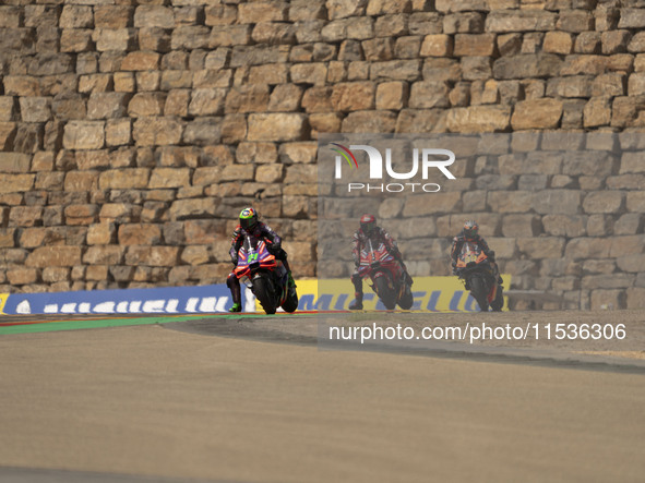 Franco Morbidelli (Ita-Pramac Racing Ducati), Francesco Bagnaia (Ita-Ducati Lenovo Team), and Brad Binder (Saf-Red Bull KTM Factory Racing)...