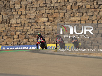 Franco Morbidelli (Ita-Pramac Racing Ducati), Francesco Bagnaia (Ita-Ducati Lenovo Team), and Brad Binder (Saf-Red Bull KTM Factory Racing)...