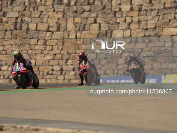 Franco Morbidelli (Ita-Pramac Racing Ducati), Francesco Bagnaia (Ita-Ducati Lenovo Team), and Brad Binder (Saf-Red Bull KTM Factory Racing)...